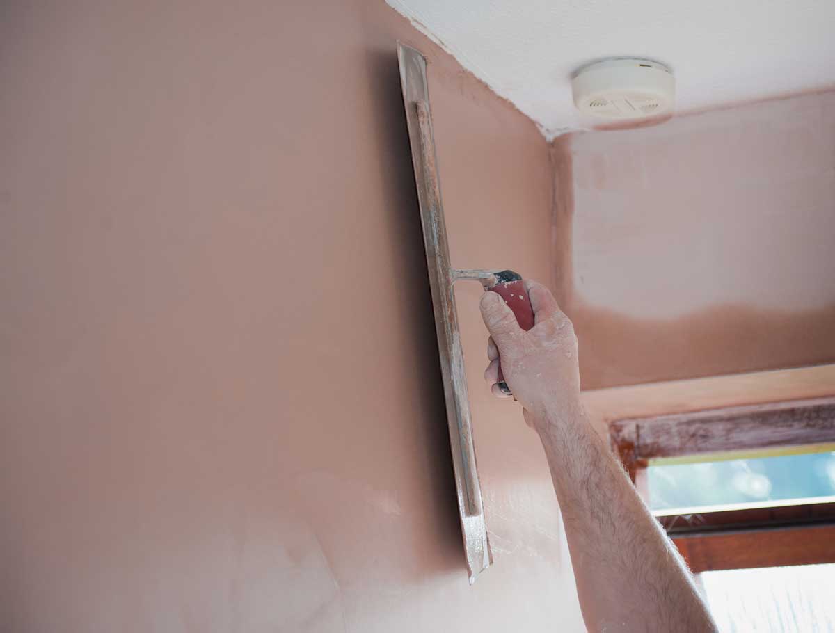 Building renovation with plaster and cladding solutions